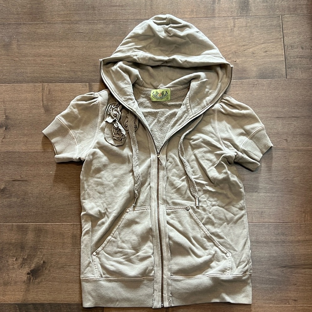 Original Juicy Couture short sleeve zip-up hoodie with flower detail. Like New.